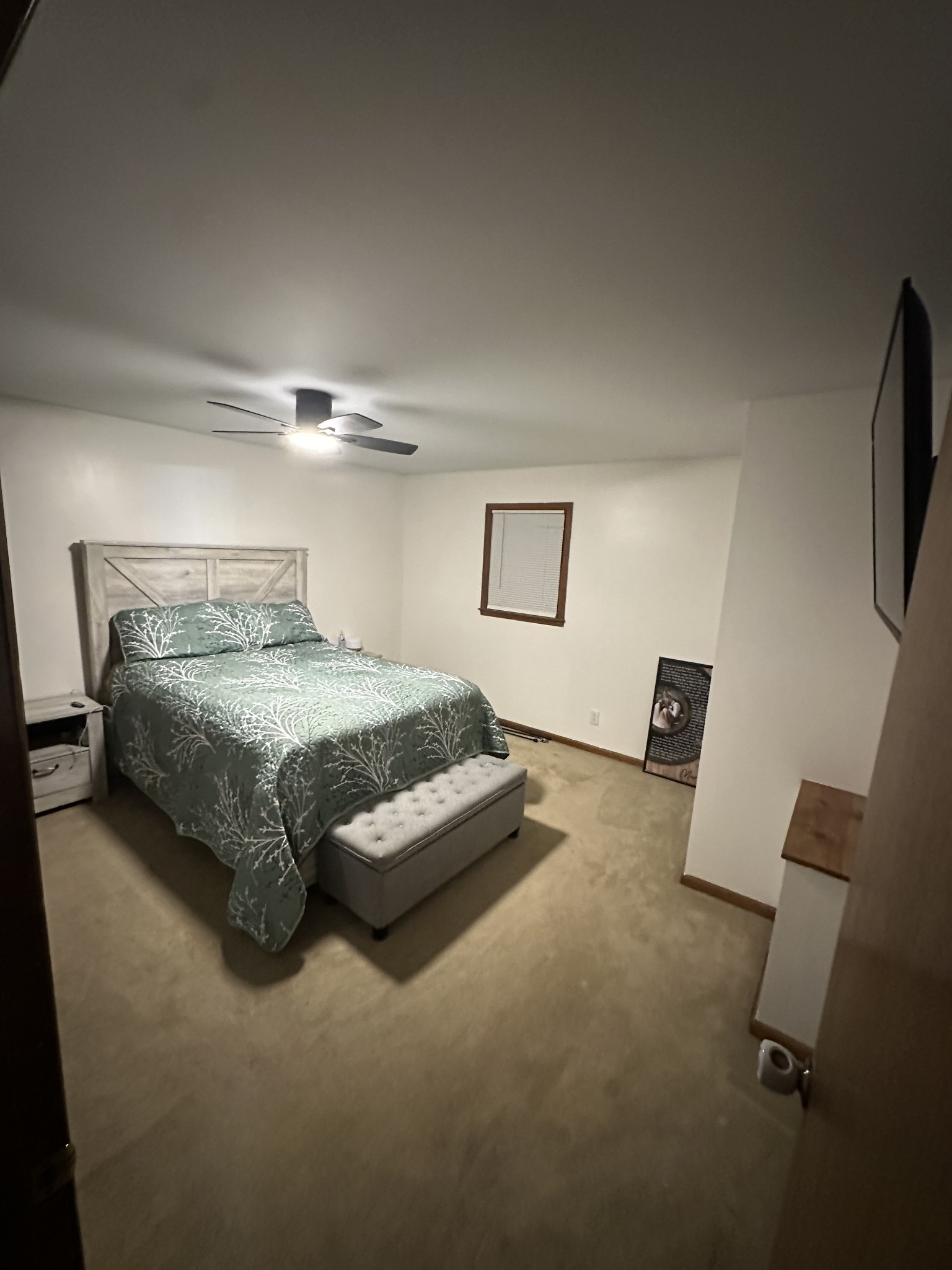 219 John Fuson Road Smithville, TN 37166 - Photo 41 of 84 a bedroom with a bed and a flat screen tv