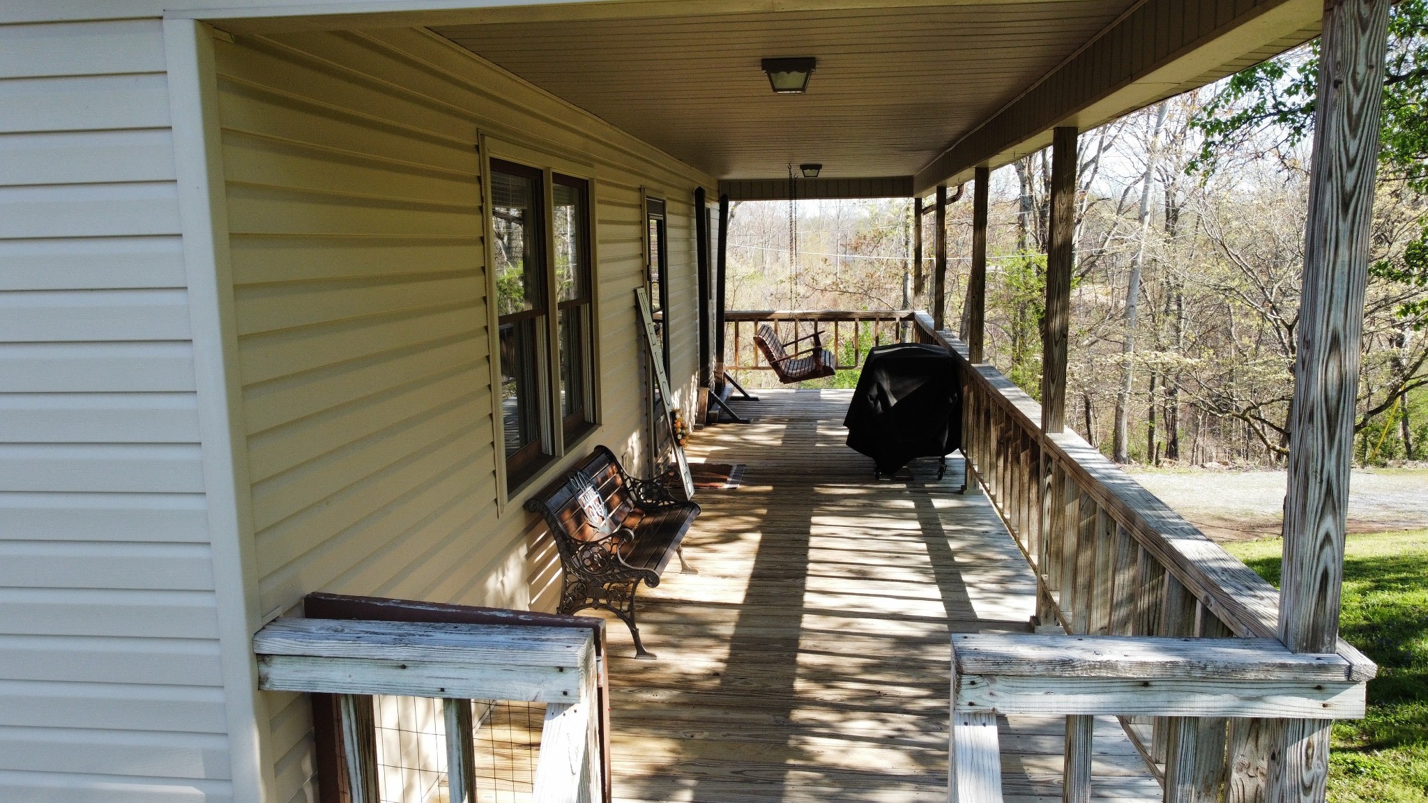219 John Fuson Road Smithville, TN 37166 - Photo 43 of 84 a view of a balcony with chairs and wooden floor