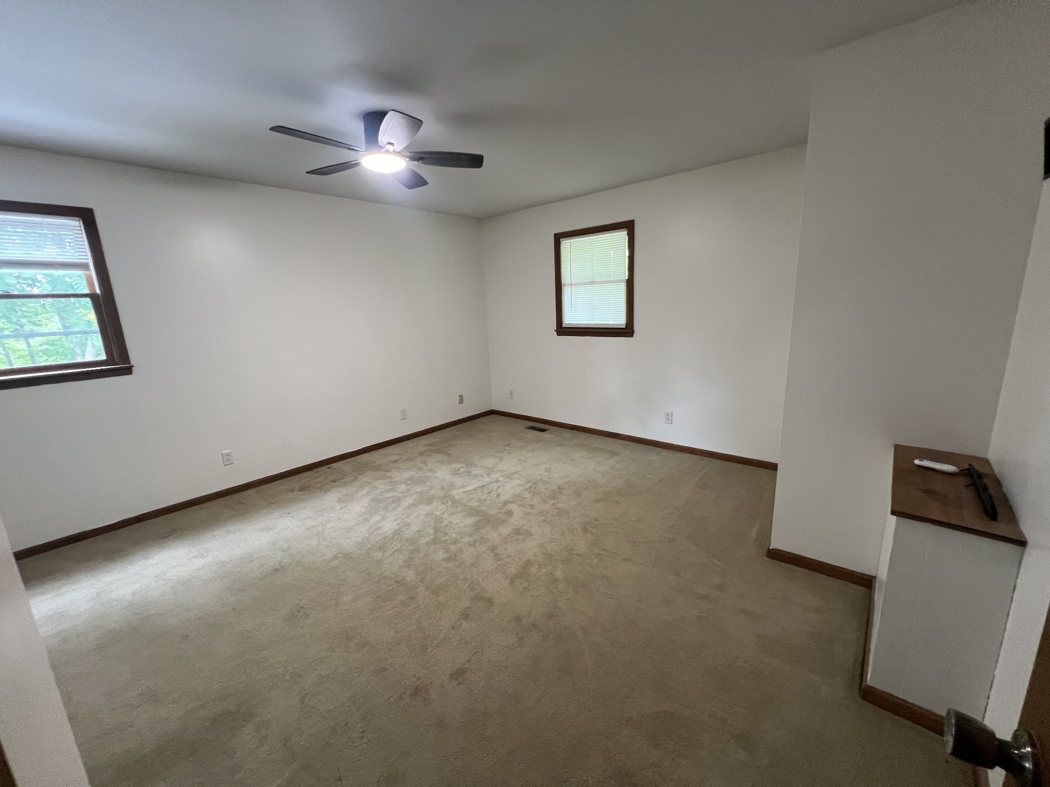 219 John Fuson Road Smithville, TN 37166 - Photo 60 of 84 an empty room with a ceiling fan and a window