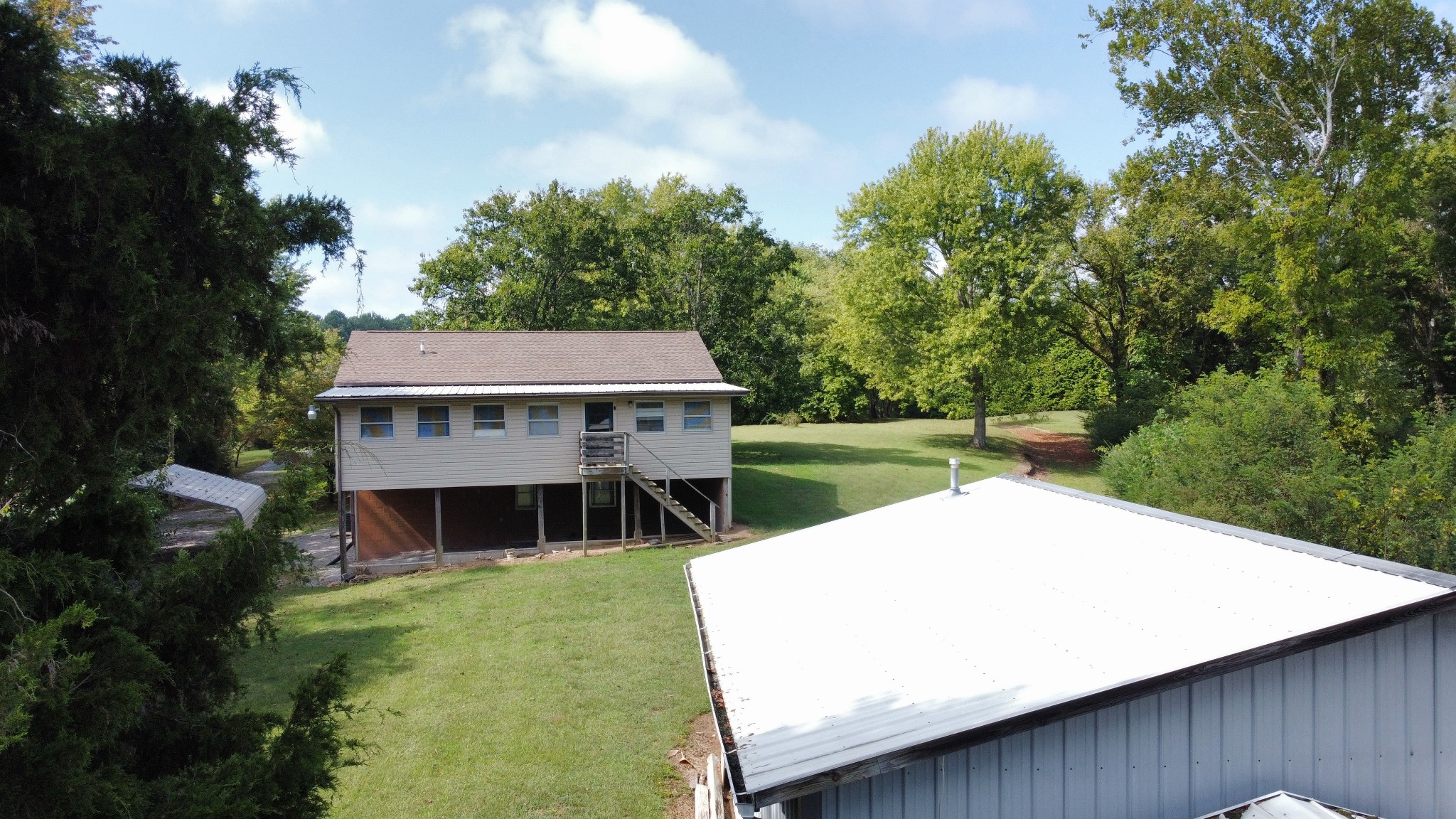 219 John Fuson Road Smithville, TN 37166 - Photo 6 of 84 a view of a house with pool and a yard