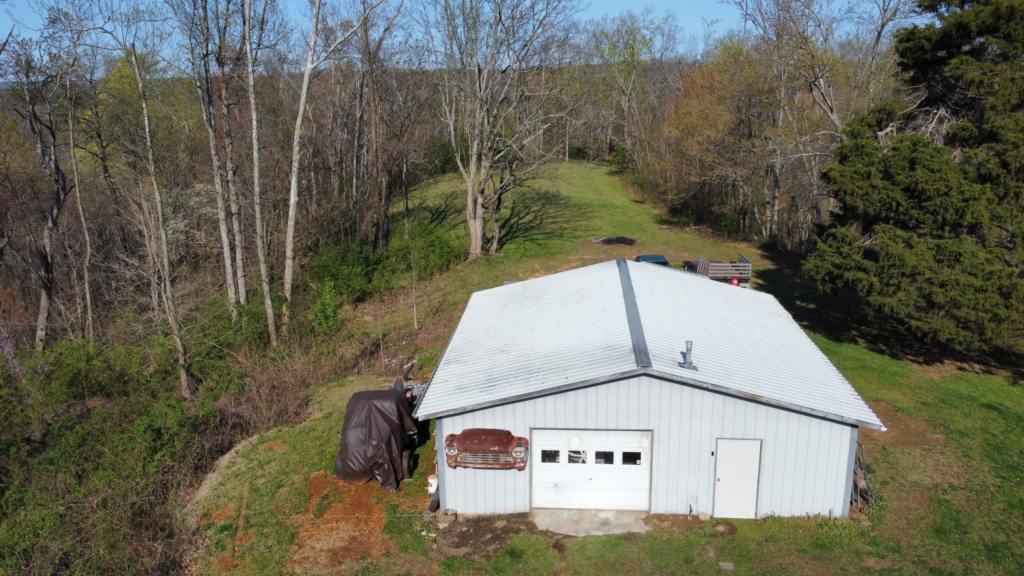 219 John Fuson Road Smithville, TN 37166 - Photo 9 of 84 a view of a wooden house with a yard