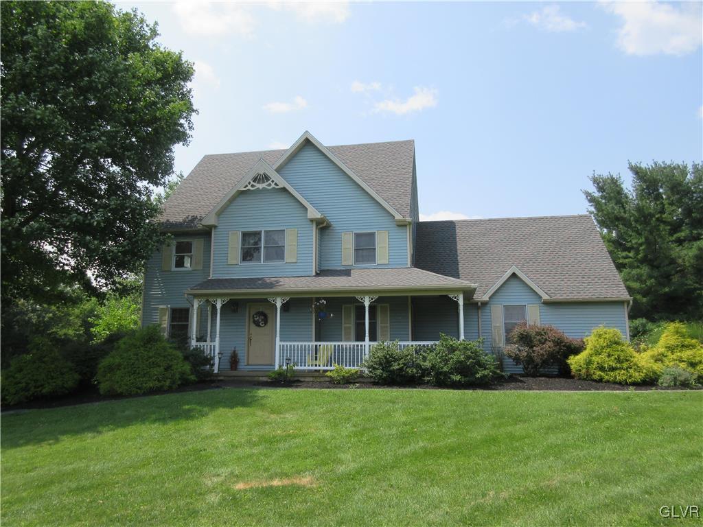 1501 Seifert Road Nazareth, PA 18064 - Photo 1 of 29 a front view of a house with a yard and trees