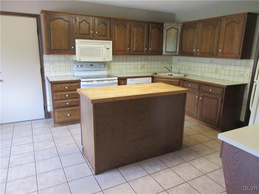 1501 Seifert Road Nazareth, PA 18064 - Photo 14 of 29 a kitchen with kitchen island cabinets and oven