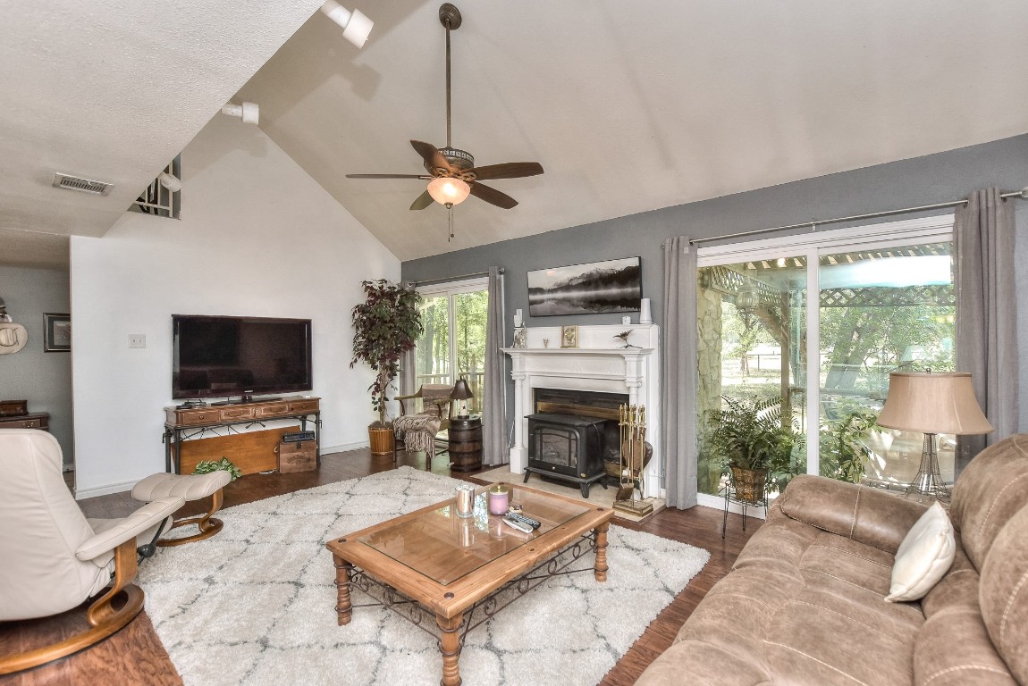 6724 Outer Avenue Leander, TX 78641 - Photo 11 of 40 a living room with furniture a flat screen tv and a fireplace