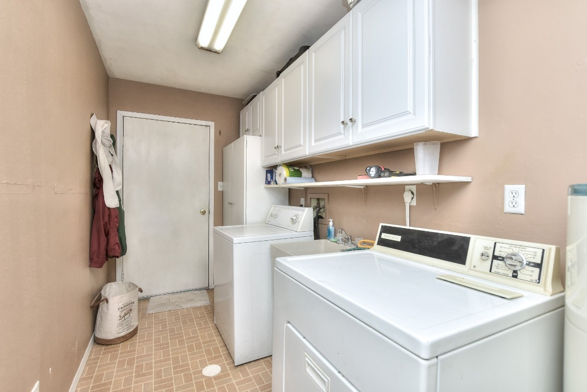 6724 Outer Avenue Leander, TX 78641 - Photo 13 of 40 a kitchen with a refrigerator and a sink