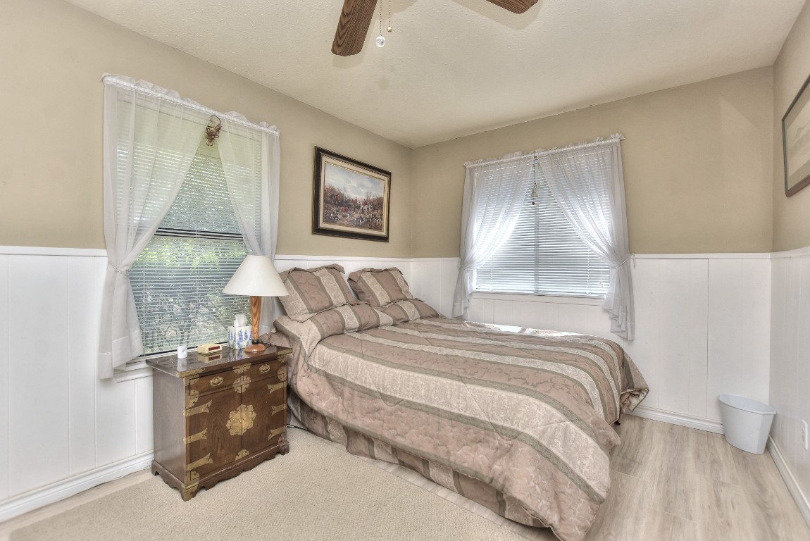 6724 Outer Avenue Leander, TX 78641 - Photo 16 of 40 a bedroom with a bed and a painting on the wall