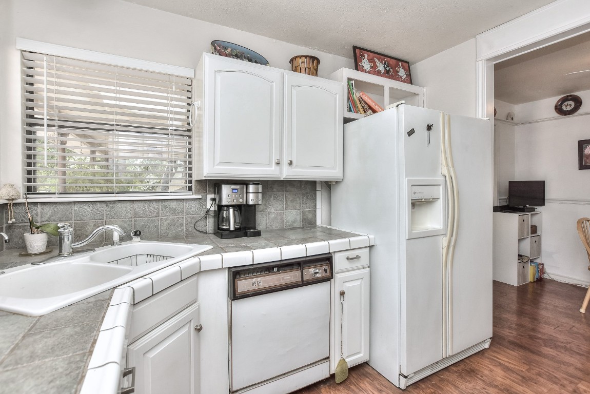 6724 Outer Avenue Leander, TX 78641 - Photo 20 of 40 a kitchen with stainless steel appliances granite countertop a sink and a refrigerator