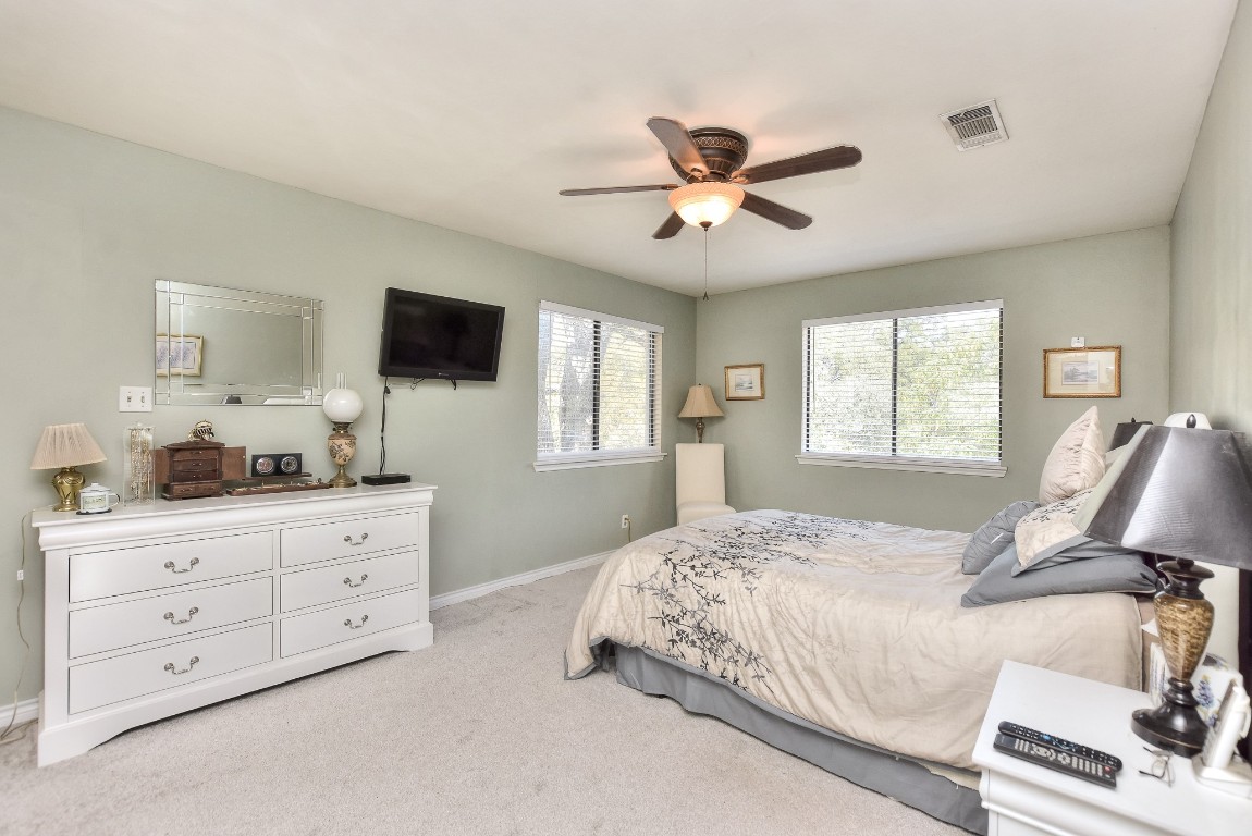 6724 Outer Avenue Leander, TX 78641 - Photo 23 of 40 a bedroom with a bed and a flat screen tv