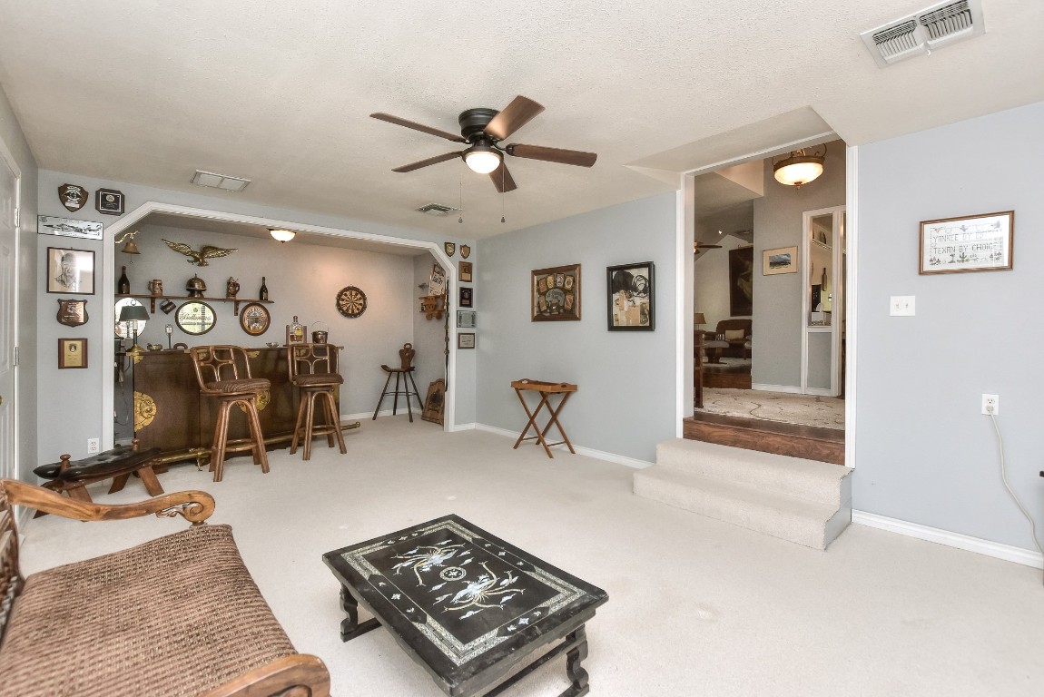 6724 Outer Avenue Leander, TX 78641 - Photo 7 of 40 a room with gym equipment and view of living room