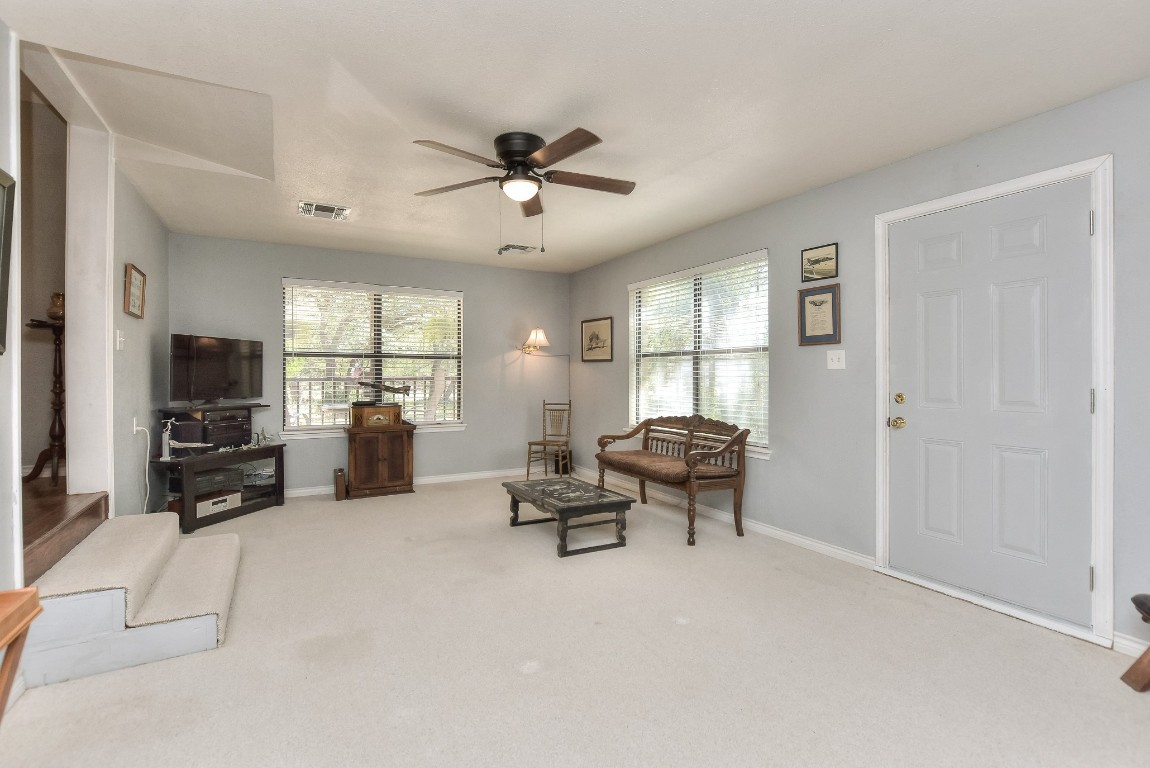 6724 Outer Avenue Leander, TX 78641 - Photo 8 of 40 a living room with furniture and a flat screen tv
