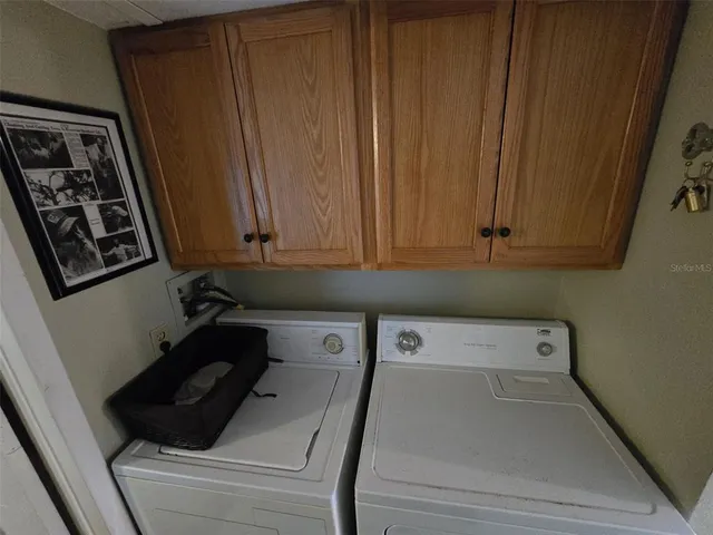 a view of a patio with table and chairs with wooden floor