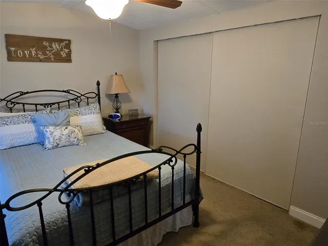a work room with furniture and a floor to ceiling window