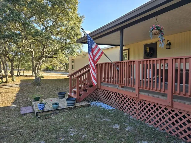 a kitchen with granite countertop a sink stainless steel appliances and cabinets