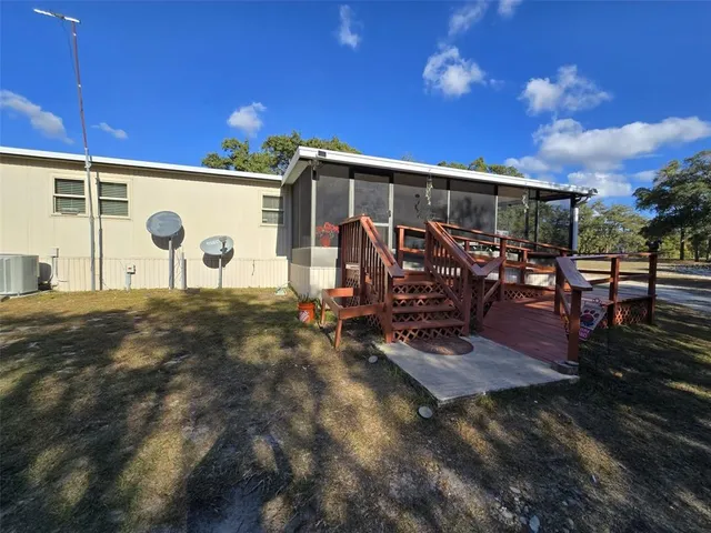 a view of a yard with trees