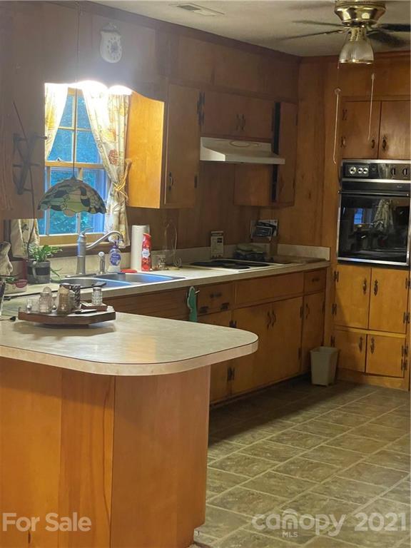 520 Neel Road Salisbury, NC 28147 - Photo 4 of 14 a kitchen with a sink and a stove top oven