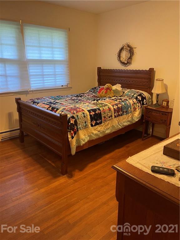 520 Neel Road Salisbury, NC 28147 - Photo 8 of 14 a bedroom with a bed and a stove