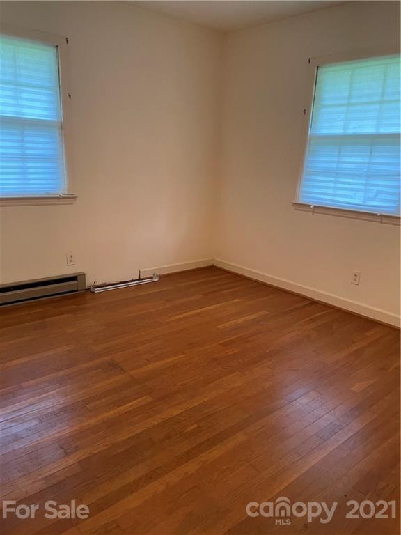 520 Neel Road Salisbury, NC 28147 - Photo 9 of 14 an empty room with wooden floor and windows