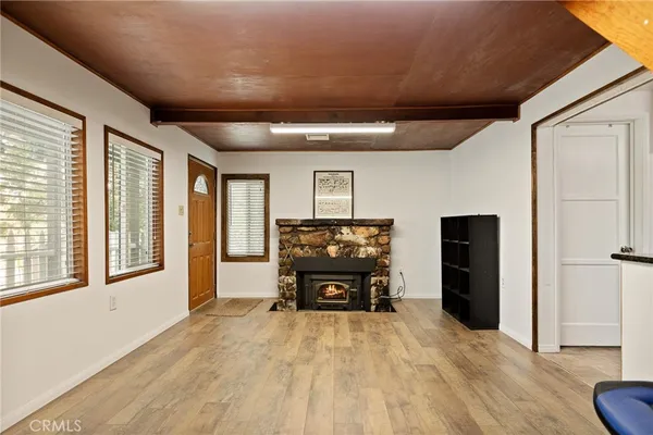 a spacious bedroom with a bed and a large window