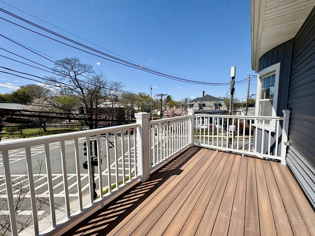 159 Parsons Street, Unit 2 Boston, MA 02135 - Photo 2 of 10 a view of balcony with wooden floor