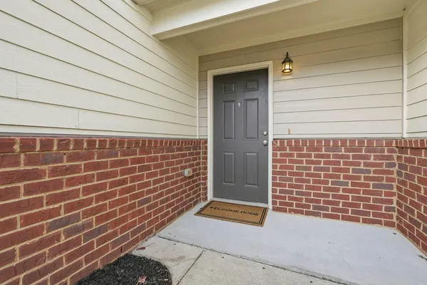 a kitchen with stainless steel appliances granite countertop a refrigerator a sink and a stove