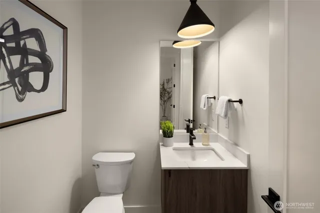 a dining room with a table and chairs