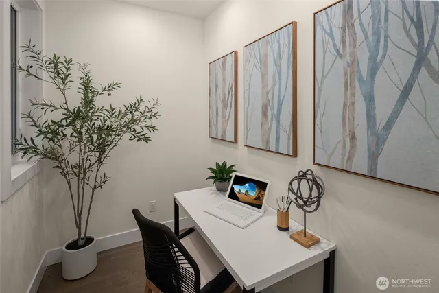 a bathroom with a granite countertop sink a toilet a mirror a vanity and shower