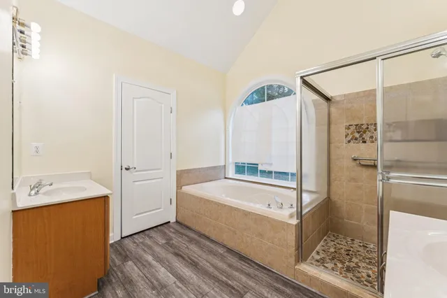 a large kitchen with kitchen island a sink stainless steel appliances and cabinets