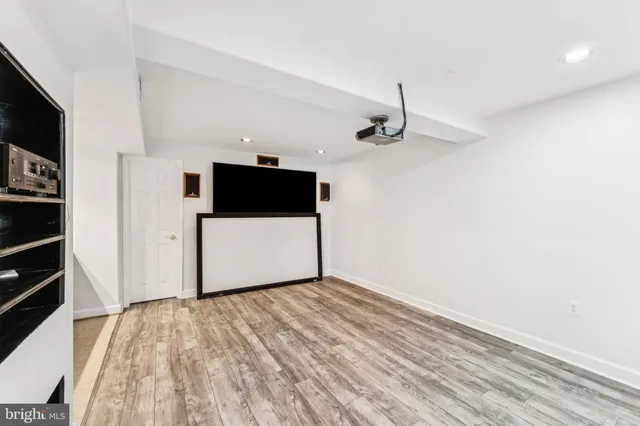 a large kitchen with stainless steel appliances granite countertop a refrigerator and a stove top oven