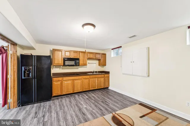 a view of a livingroom with furniture and wooden floor