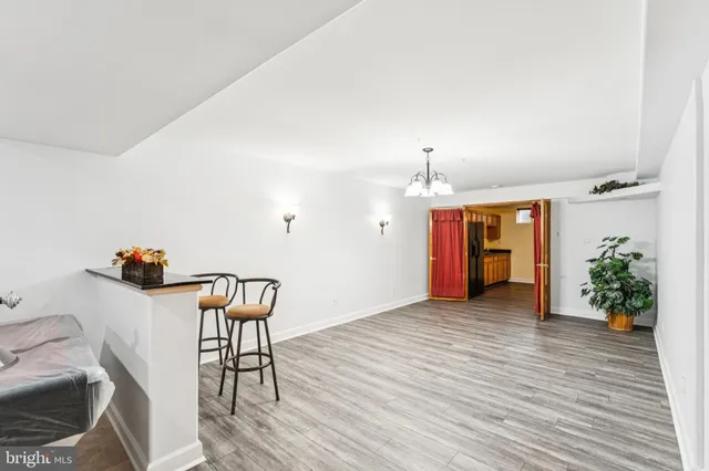 an empty room with closet and a ceiling fan