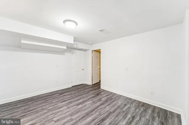 a view of a storage & utility room with a sink