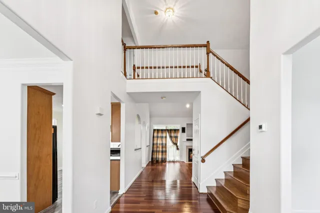 a view of an entryway with wooden floor