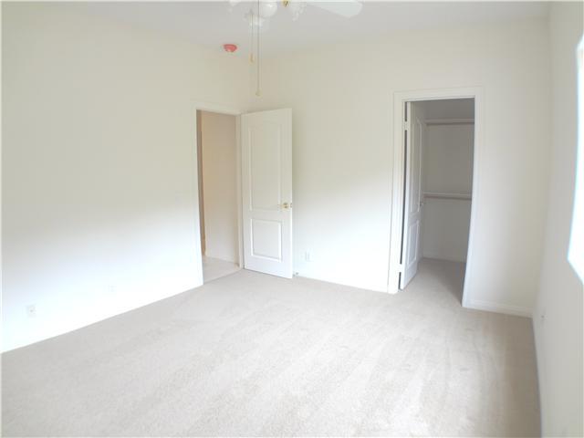 18263 Chablis Road Ramona, CA 92065 - Photo 13 of 25 The first bedroom off of the family room boasts a large walk in closet and ceiling fan.