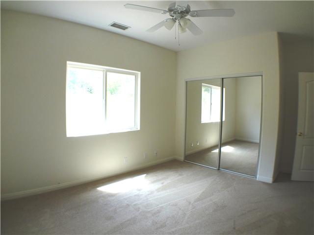 18263 Chablis Road Ramona, CA 92065 - Photo 14 of 25 This bedroom has a ceiling fan and mirrored closet doors.
