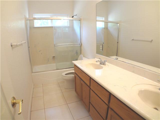 18263 Chablis Road Ramona, CA 92065 - Photo 16 of 25 Double sinked shared full bathroom centrally located at the end of the hall with easy access from all three bedrooms.