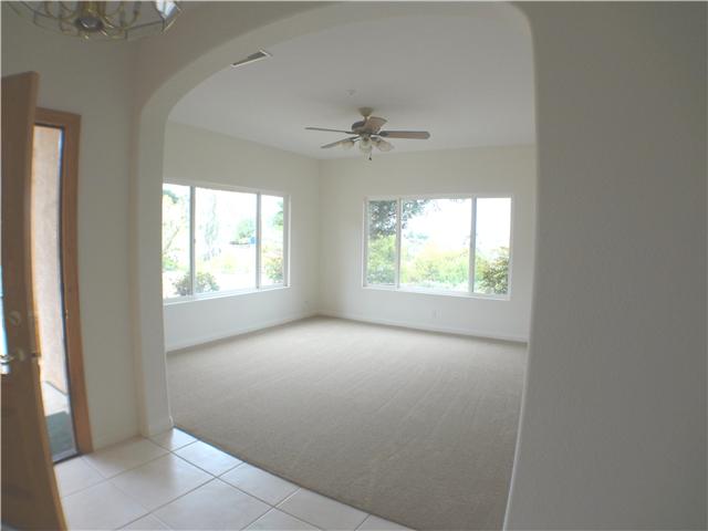 18263 Chablis Road Ramona, CA 92065 - Photo 6 of 25 Upon entering the home you will find an arched entry to living room with views of the Ramona Valley. Lots of light in this large living room.