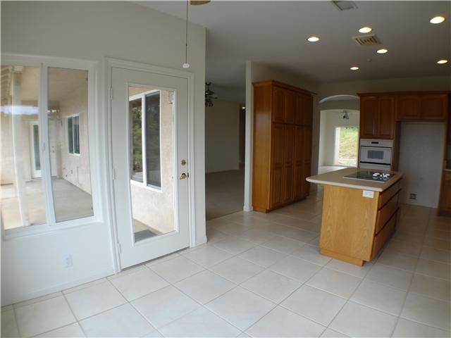 18263 Chablis Road Ramona, CA 92065 - Photo 9 of 25 Easy access from the breakfast area to the kitchen, family room and outside patio with a panoramic view of the Ramona Valley.