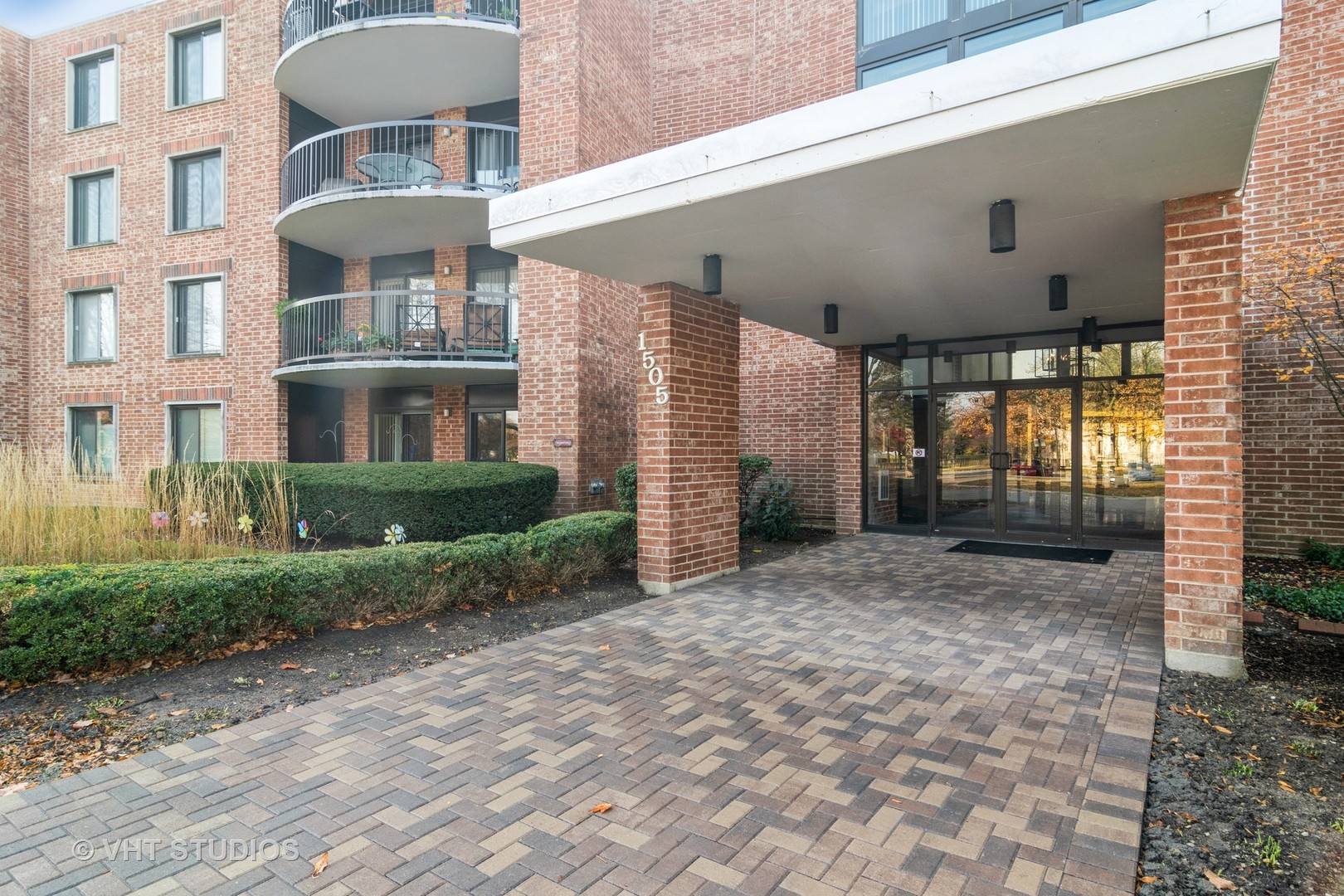 1505 East Central Road, Unit 111B Arlington Heights, IL 60005 - Photo 2 of 10 a view of a building with a porch