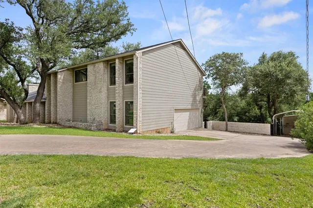 a backyard of a house with lots of green space