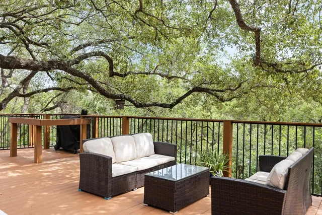 swimming pool view with a seating space