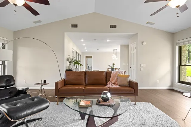 a living room with furniture and a potted plant
