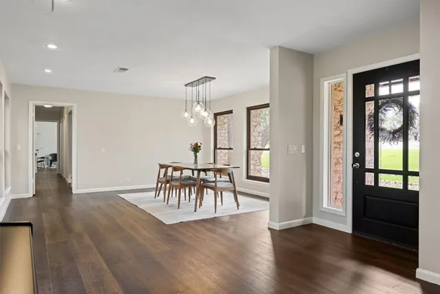 a view of a livingroom with furniture and hardwood floor