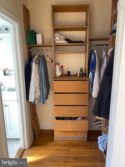 2040-2040 Belmont Road Northwest, Unit 423 Washington, DC 20009 - Photo 16 of 18 a view of walk in closet with clothes and shoes
