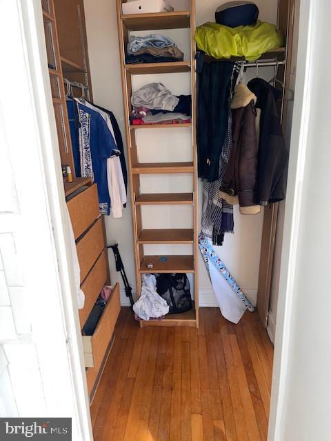 2040-2040 Belmont Road Northwest, Unit 423 Washington, DC 20009 - Photo 17 of 18 a view of walk in closet with clothes and shoes