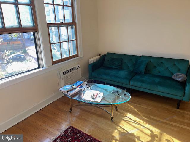 2040-2040 Belmont Road Northwest, Unit 423 Washington, DC 20009 - Photo 6 of 18 a living room with furniture and a window