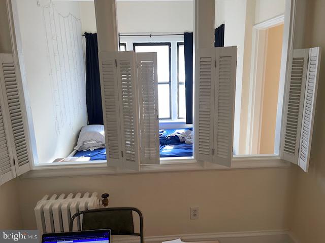 2040-2040 Belmont Road Northwest, Unit 423 Washington, DC 20009 - Photo 8 of 18 a view of front door and bedroom