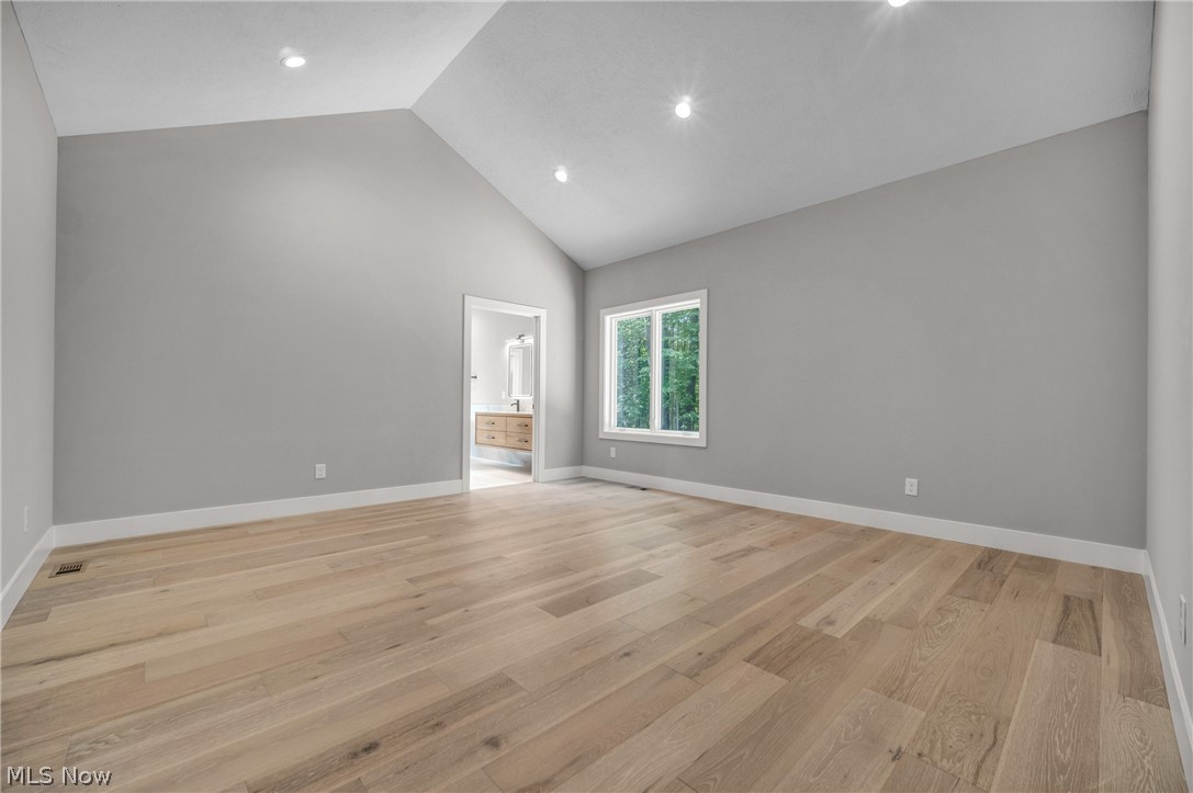 4009 Brainard Road Beachwood, OH 44122 - Photo 23 of 50 Primary bedroom featuring high vaulted ceiling and light hardwood floors