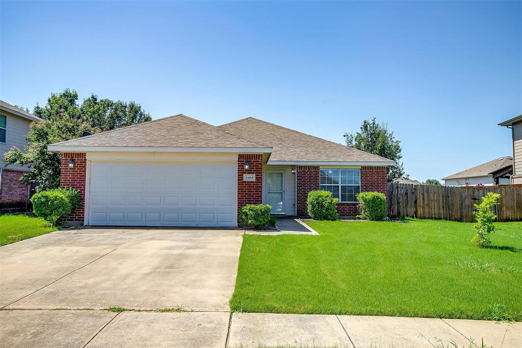1604 Withers Way Krum, TX 76249 - Photo 1 of 1 a front view of house with yard and green space
