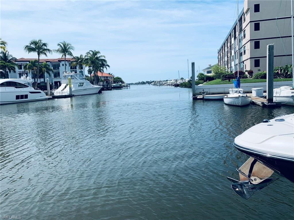 801 River Point Drive Naples, FL 34102 - Photo 7 of 10 a view of a lake with houses