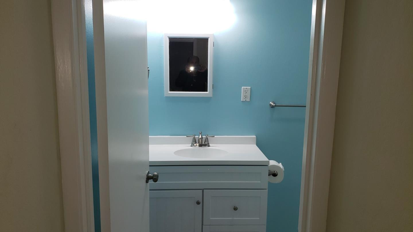 160 Clarendon Road Pacifica, CA 94044 - Photo 58 of 81 a bathroom with a sink and a mirror